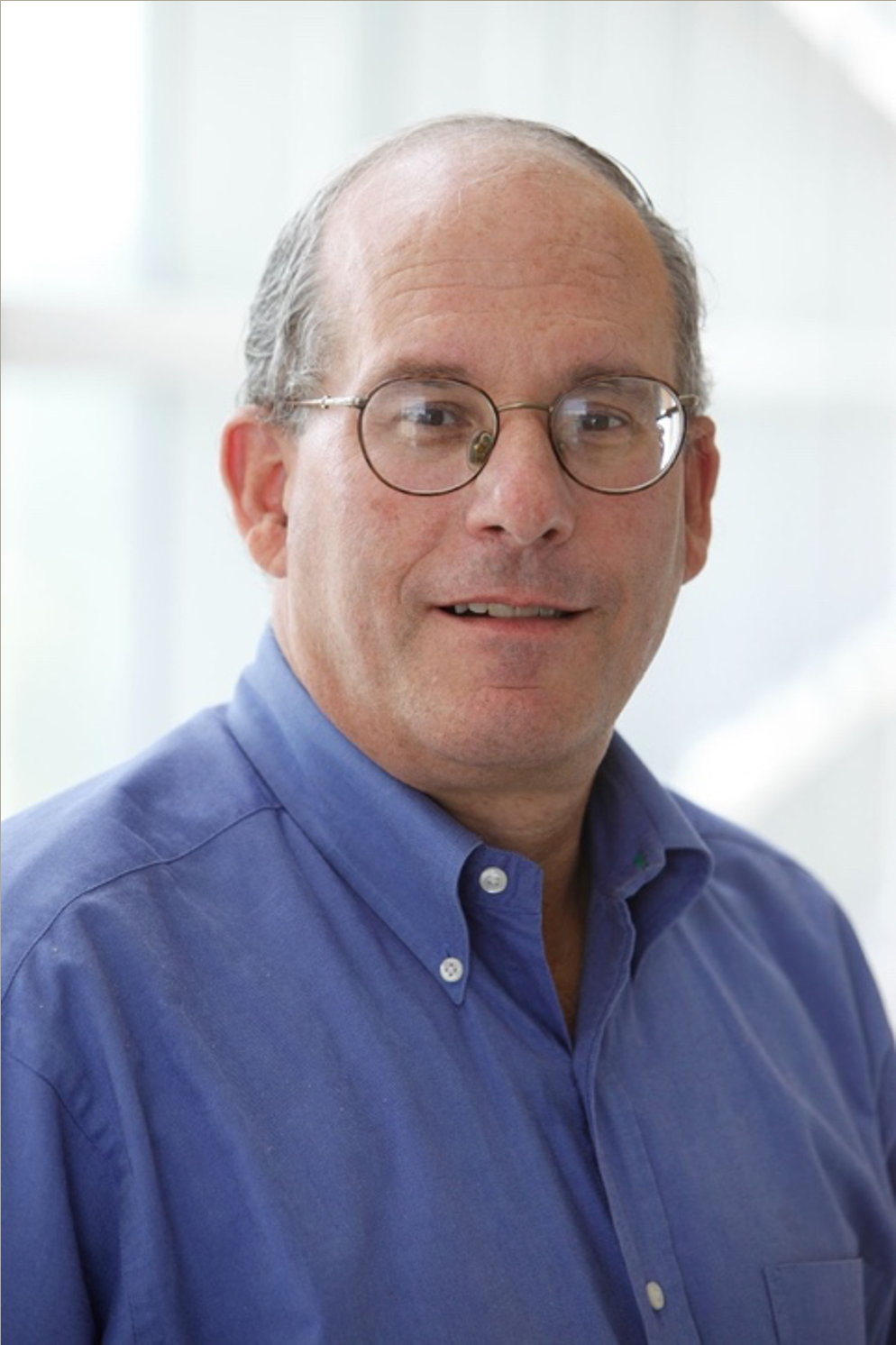 Picture of Barry Snider. A middle aged man in blue shirt and glasses